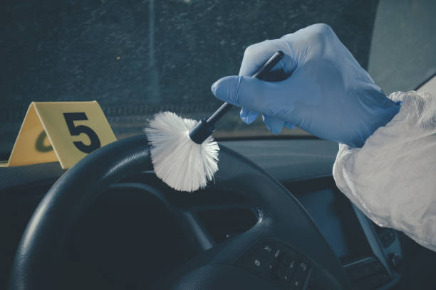 istock CSI - searching and developing of fingerprints on place of murder in car 2067928368