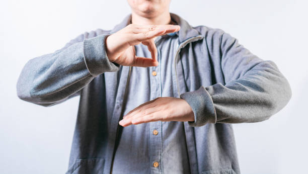 istock People talking in sign language isolated. Interpreter talking in sign language. Unrecognizable person gesturing in sign language 2067938391