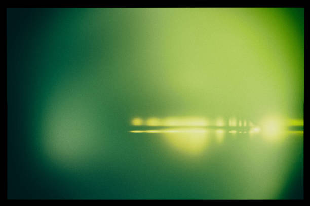 istock Abstract blurry green background in a black frame and light horizontal lines. 2067955293