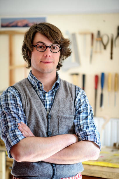 istock Portrait of a violin maker in his lab 2067956357