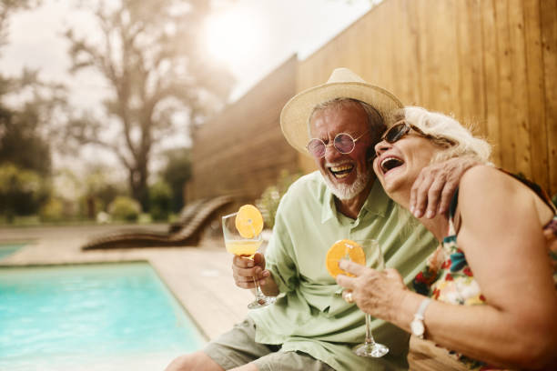 istock Cheerful senior couple having fun by the pool. 2067959569