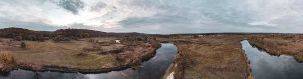istock Aerial panorama on river curve in autumn valley 2067966029