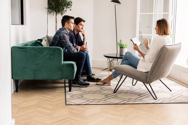 istock Men in Thoughtful Therapy Session with Female Counselor 2067980556