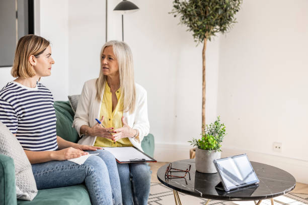 istock Two Women Sharing a Relaxing Coffee Break in a Modern Home 2067981110