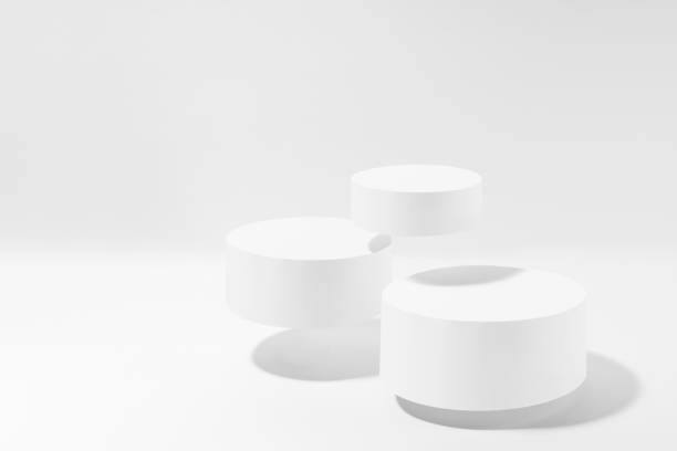 istock Three levitate white round podiums in hard light, shadow, mockup on white background. Template for presentation cosmetic products, gifts, goods, advertising, design, display, showing in simple style. 2067990652