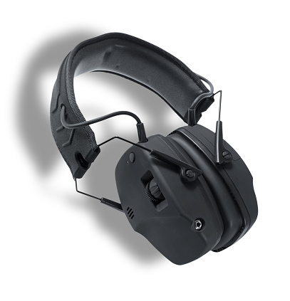 Headset that uses electronics to protect a shooter's hearing when firing a gun