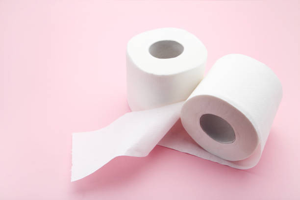 istock White rolls of toilet paper on pink background 2068038430