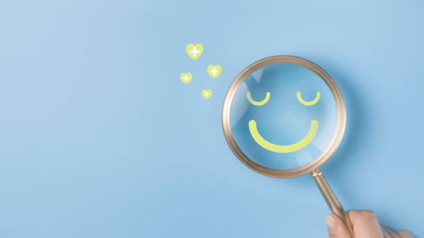 istock Smile face emotion happy inside magnifying glass with plus sign show positive thinking satisfaction happiness, excellent concept. Health care recovery rating best feeling assessment. 2068079691