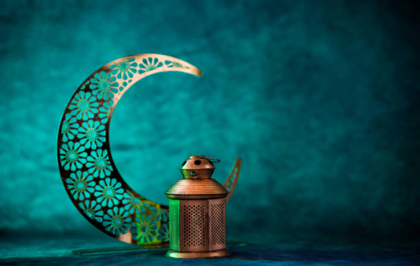 istock Crescent moon with lantern Ramadan Kareem and Eid Mubarak concept background 2068117893