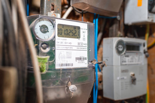 istock Two smart electric power meter counter measuring power usage.Close-up of modern smart grid residential digital power supply meter.Indoors shot.Selective focus. 2068128589