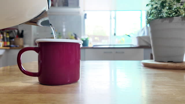 Pour hot water into a red glass.