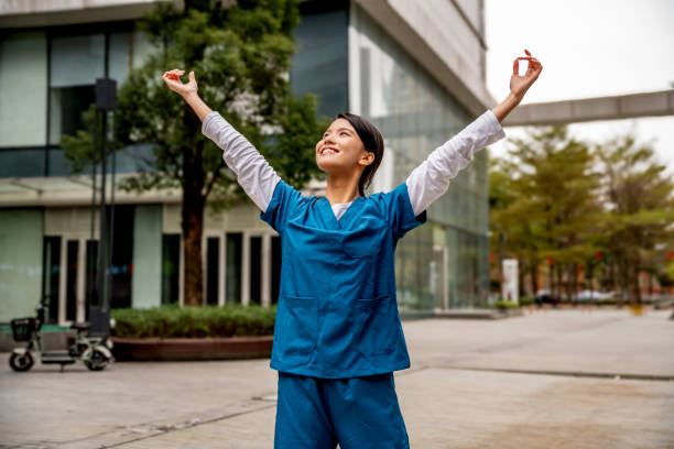 istock Healthcare worker with raised arms 2068156999