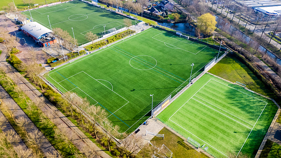 Aerial photo of the residential area of Amersfoort Nieuwland with the football / soccer fields - mid day with sun