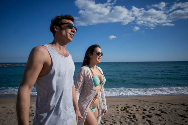 istock Couple traveling on the beach 2068159157
