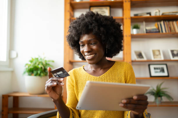 istock Beautiful woman pay her order online using credit card 2068193945