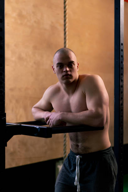 istock in the gym bald trainer stands near the horizontal bar for push-ups and pull-ups 2068199871
