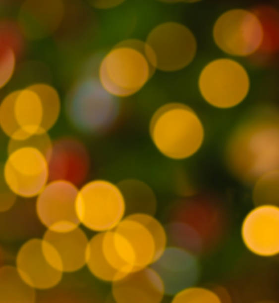 istock Bright lights on a Christmas tree in bokeh for a background 2068223381