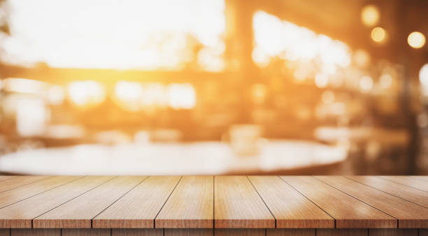 istock Empty wooden table top with lights bokeh on blur restaurant background. 2068240391