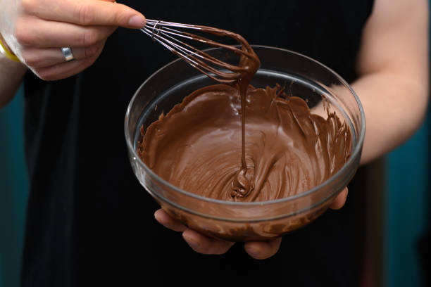 istock Brown shiny liquid Belgian chocolate melted in a bowl 2068246417
