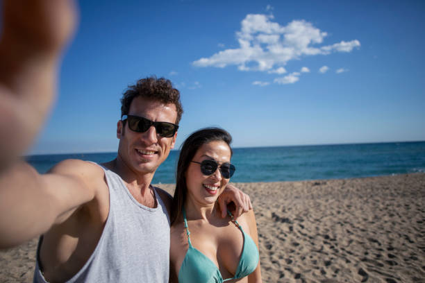 istock Couple traveling on the beach 2068269931