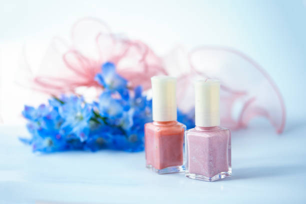 Close-Up Of Pink Nail Polish Against White Background
