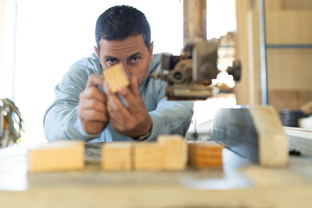 man working in a carpentry shop. Photographs of the work and backgrounds for publications with copy space.