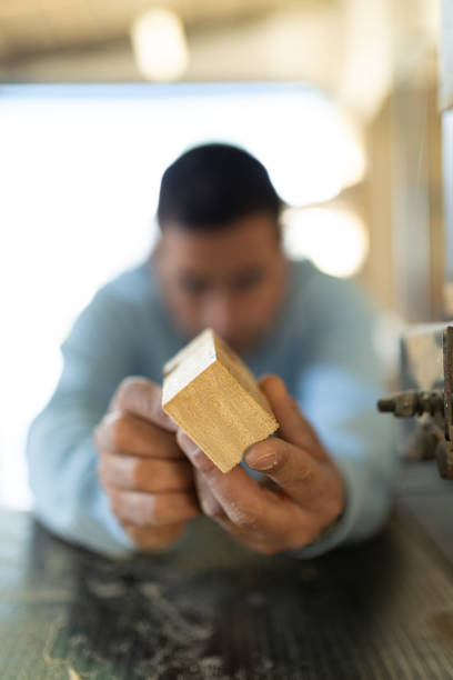man working in a carpentry shop. Photographs of the work and backgrounds for publications with copy space.