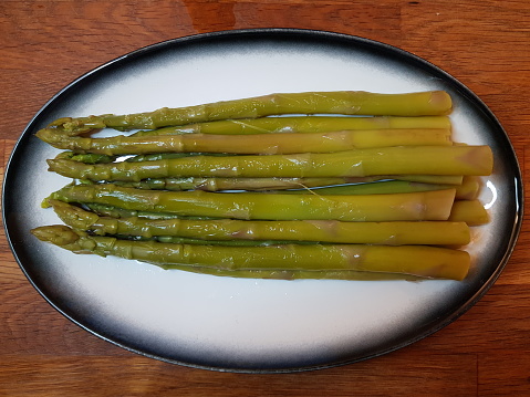 Cooked asparagus on a plate, Glasgow Scotland England UK