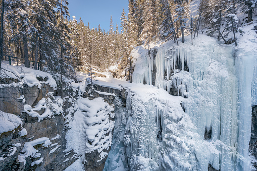 View of frozen Upper Falls at Johnston Canyon in Banff National Park, Alberta, Canada