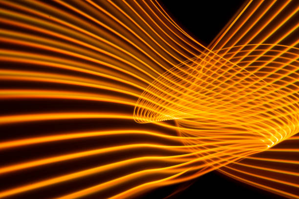 Abstract modern banner design. Glowing warm lines on black background. High quality photo