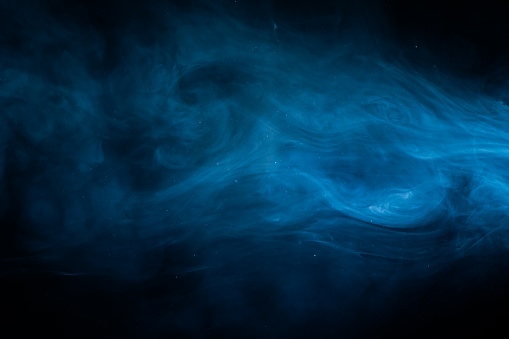 Smoke blue cloud. Fog haze on dark background. . High quality photo