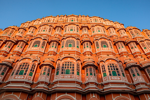 Jaipur, India 16 February 2024. Hawa Mahal is a palace built from red and pink sandstone with exterior inspired by honeycomb and intricate latticework