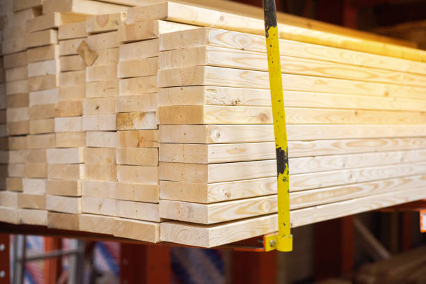 istock Stack of framing studs on elevated rack with gauge steel guard post prevent pine spruce woods falling at lumber yard of hardware home improvement store in Dallas, Texas, storage warehouse safety 2068367881