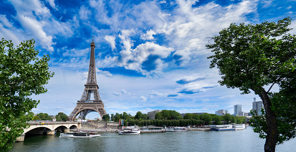 Paris famous landmarks. Eiffel Tower iwith green tree over river, Paris France, web banner panorama