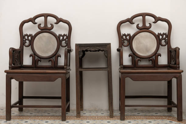 set of old-style black wood chairs and table