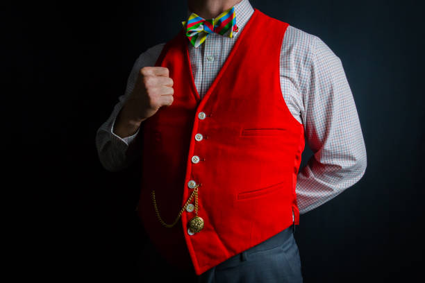 Close-up of an unrecognizable man adjusting his tie, while wearing suit