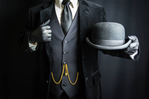 istock British Gentleman Holding Bowler Hat 2068427268