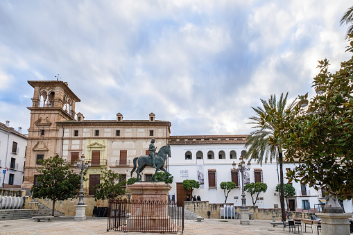 Madrid, Spain - June 04, 2023: Ticket offices of the Museo Nacional del Prado in Madrid, Spain with many people walking around them and queuing up to buy tickets on a somewhat cloudy day. It is one of the most important art galleries in the world.