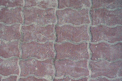 red tiles on the road close-up texture