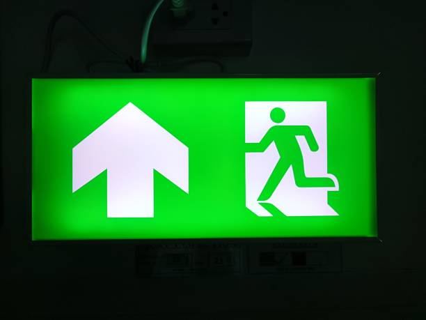 istock Exit Sign with Man Running Out of Door 2068467831