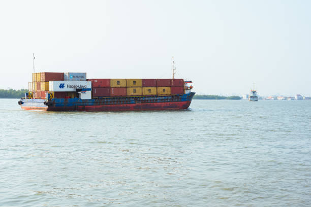 Container ship NP Lovegistics 2 with containers of Hapag-Lloyd, Maersk, MSC, and others goes along Chao Phraya River on March 1, 2024, in Samut Prakan, Thailand.