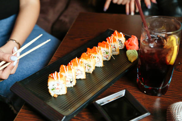 istock Plate of Sushi With Chopsticks and a Drink 2068531702