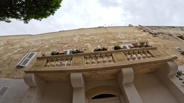 Old Building With Balcony From Below In Mdina, Malta