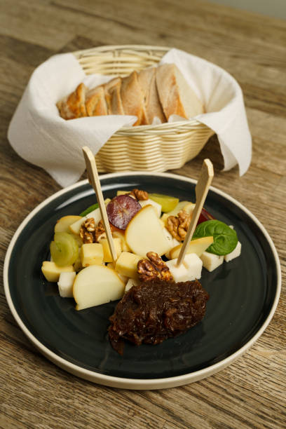istock Various types of cheese on a plate with grapes and nut and bread 2068558432