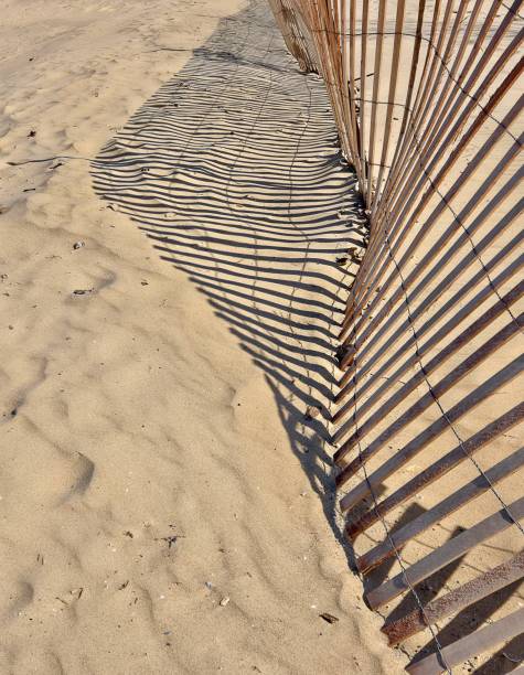 istock Crooked Beach Fence With Shadow 2068611325