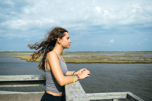 Contemplative Gen z girl looking at the horizon