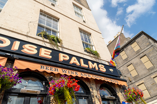 Edinburgh, Scotland, August 2023. Pub sign near the Royal Mile. Paradise Palms pub.
