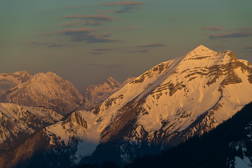 The snowy Mount Soiernspitze in the Karwendel mountain range in the European Alps illuminated orange at sunrise,Bavaria,Germany