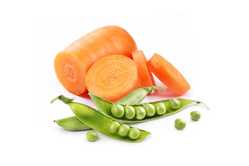 carrots with green peas on a white background