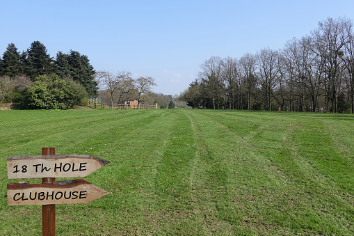 Golf course  Directional arrows 18th hole and clubhouse